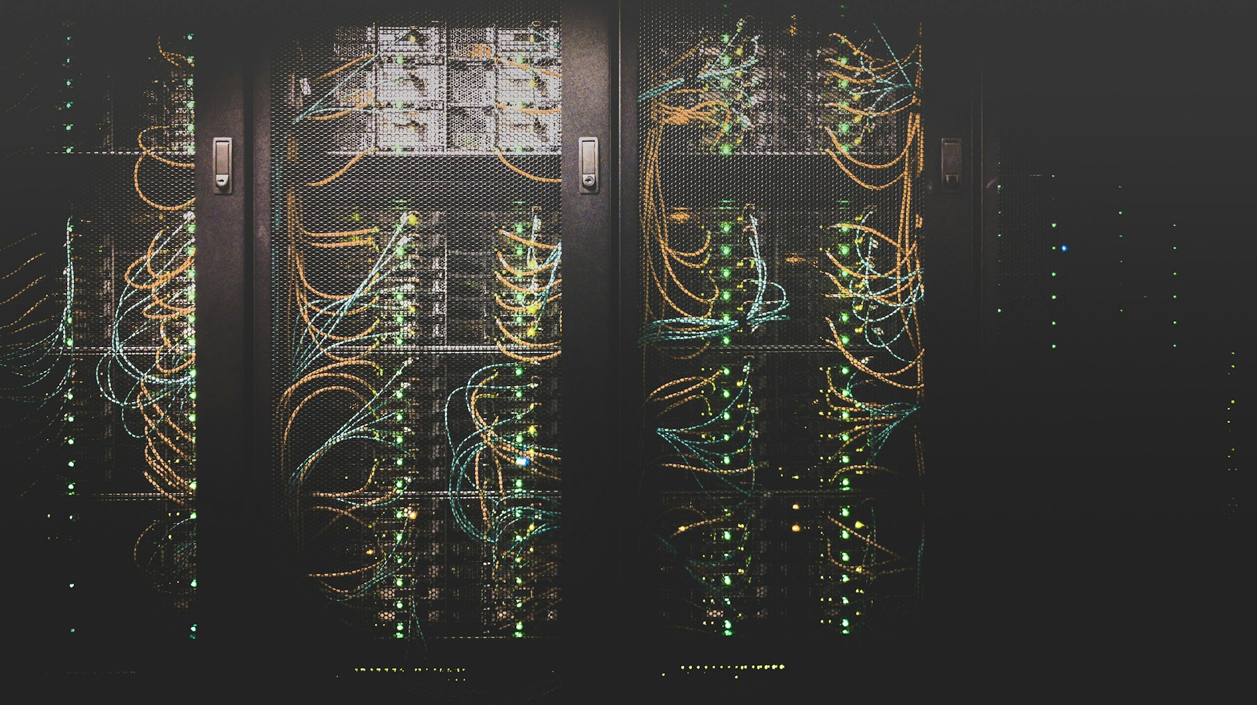 Rows of servers and network cabling inside a data centre