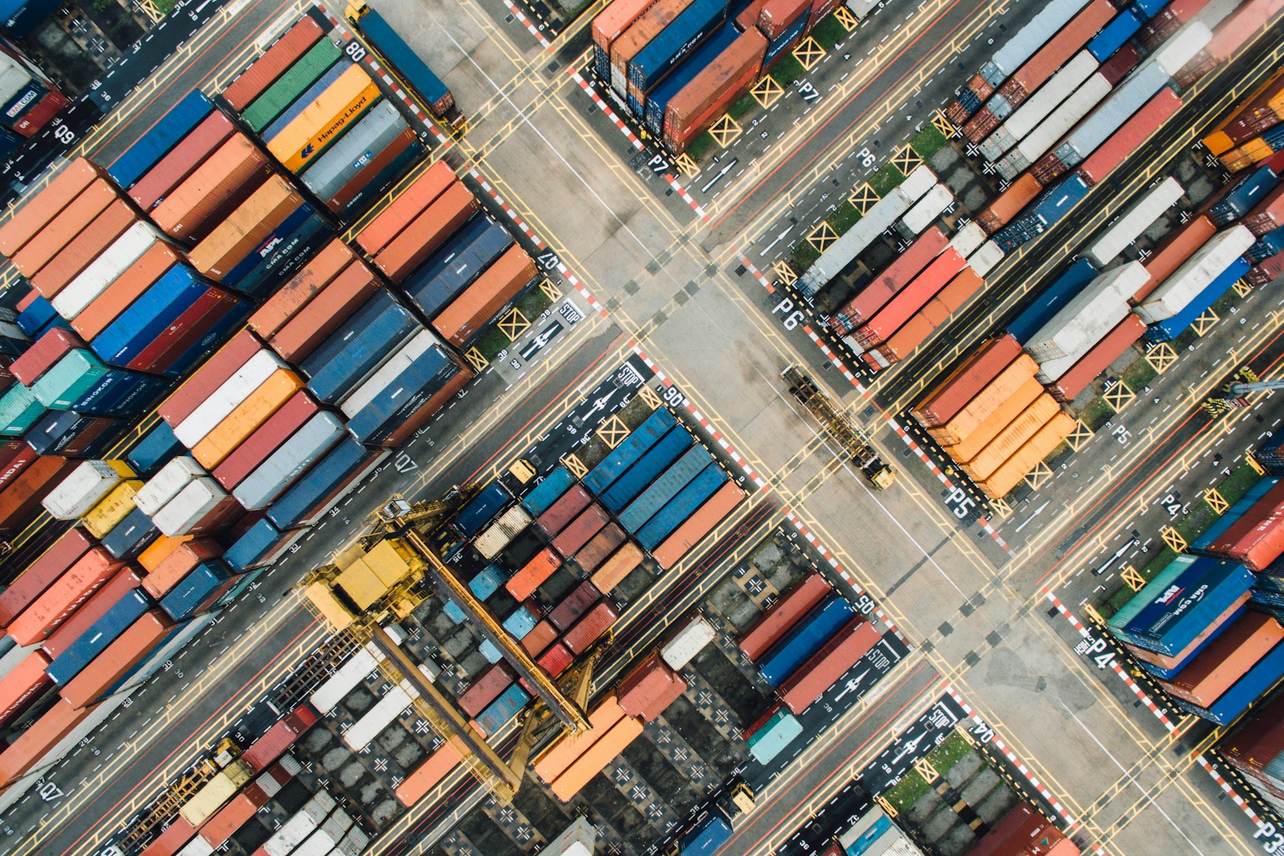 Aerial view of a shipping container yard laid out in blocks