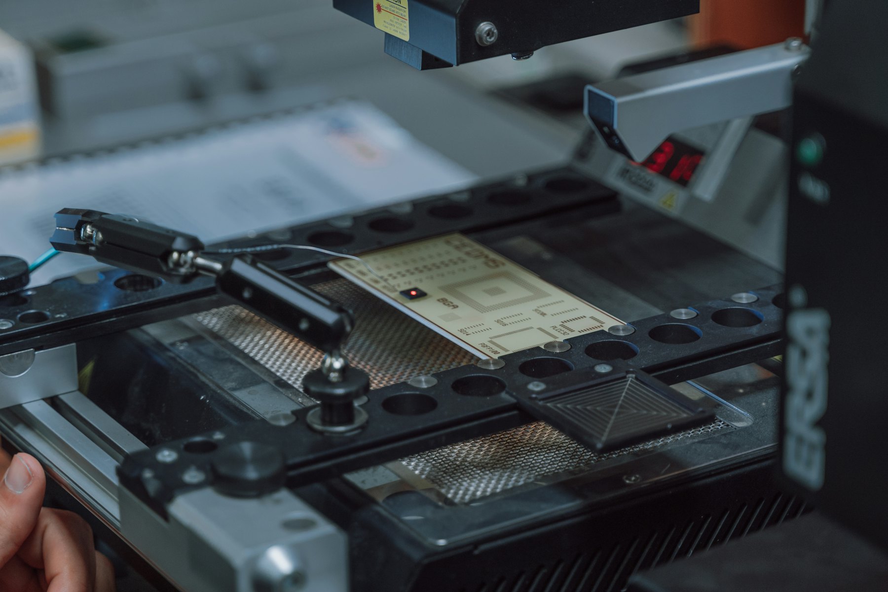 Inspection station examining a component on a circuit board