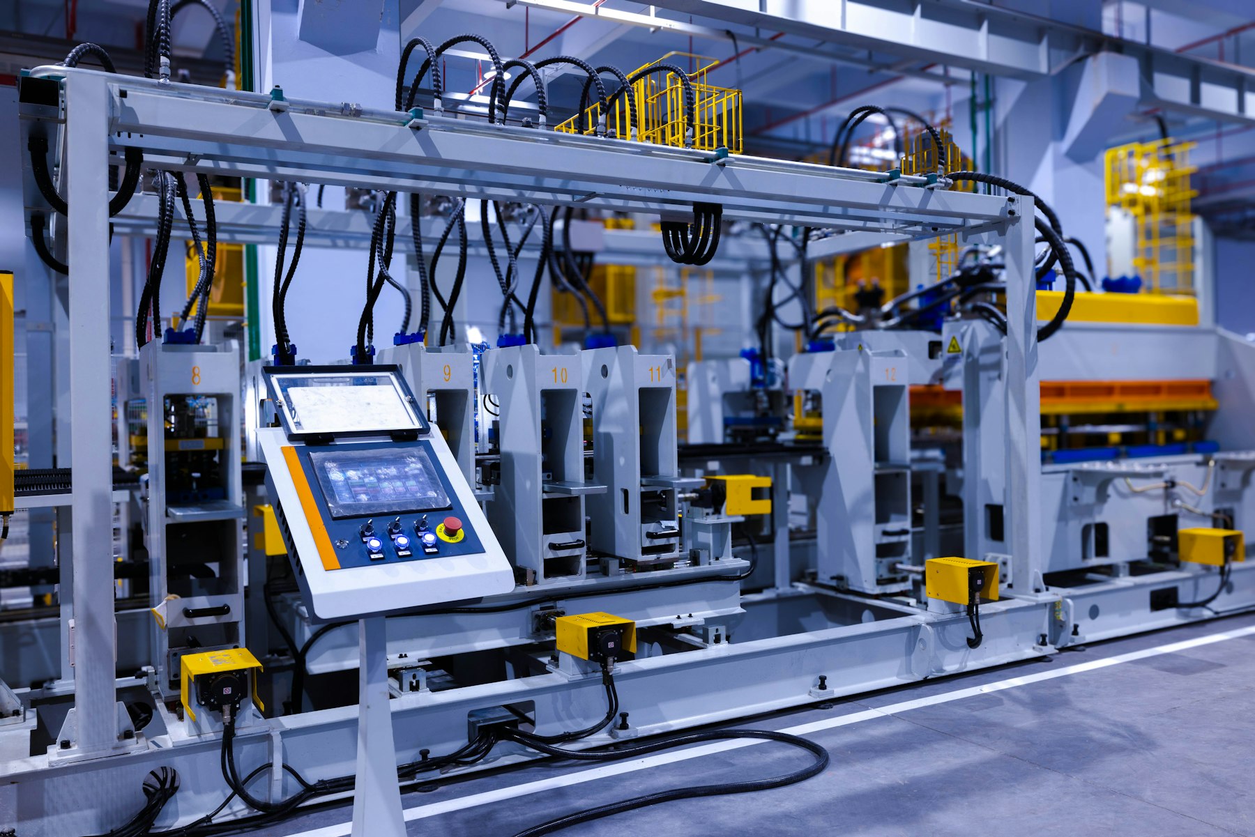 Control panel with a touchscreen on an industrial manufacturing machine