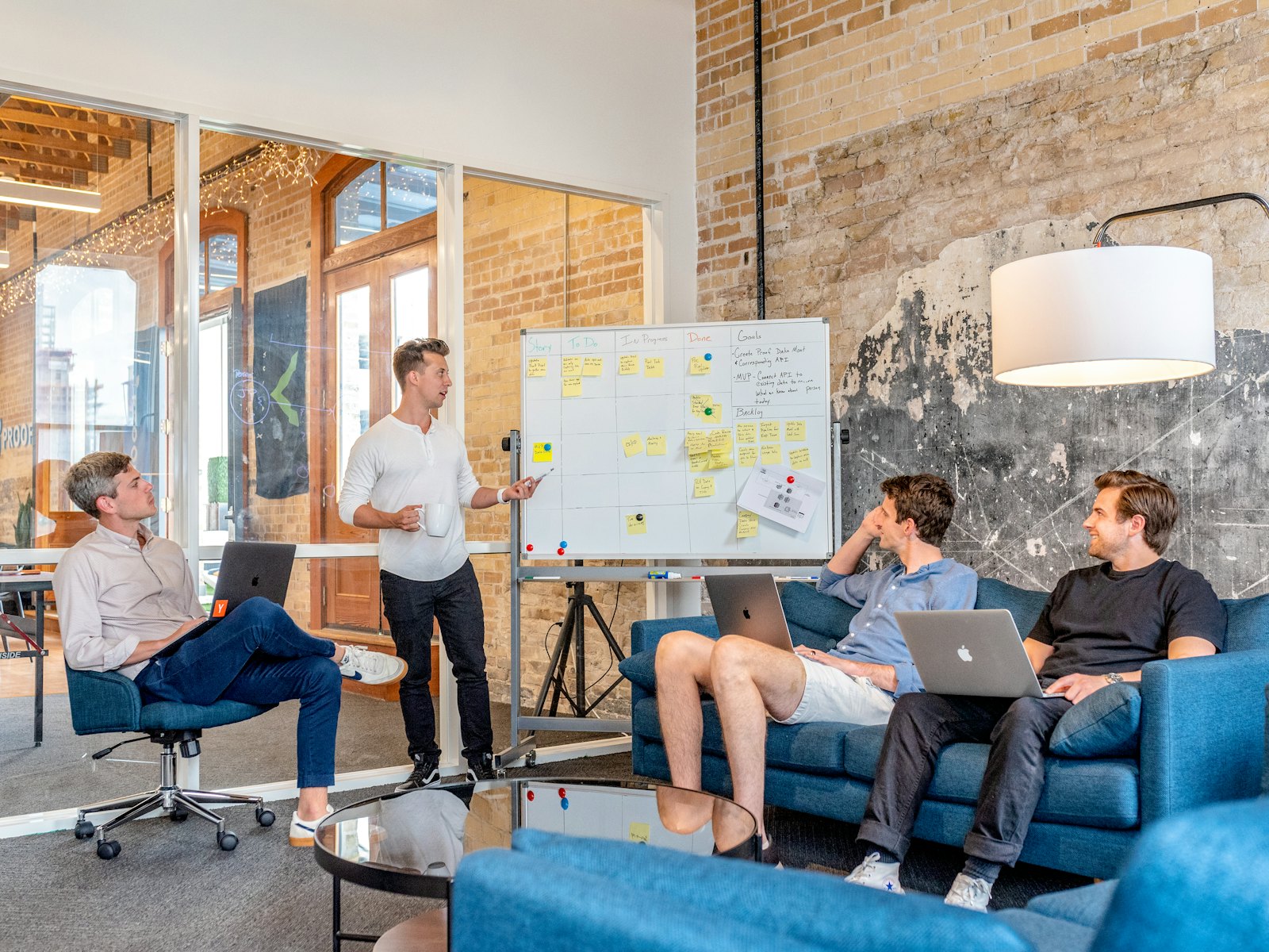 Team working through a plan at a whiteboard